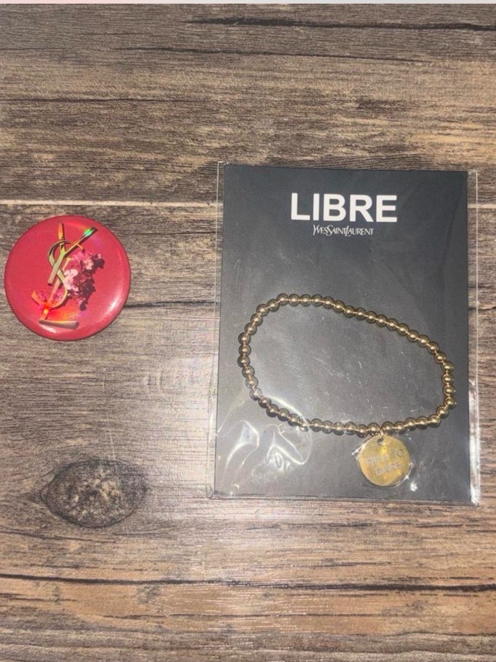 YSL Yves Saint Laurent LIBRE Gold Beaded Charm Bracelet & Floral Cassandre Logo